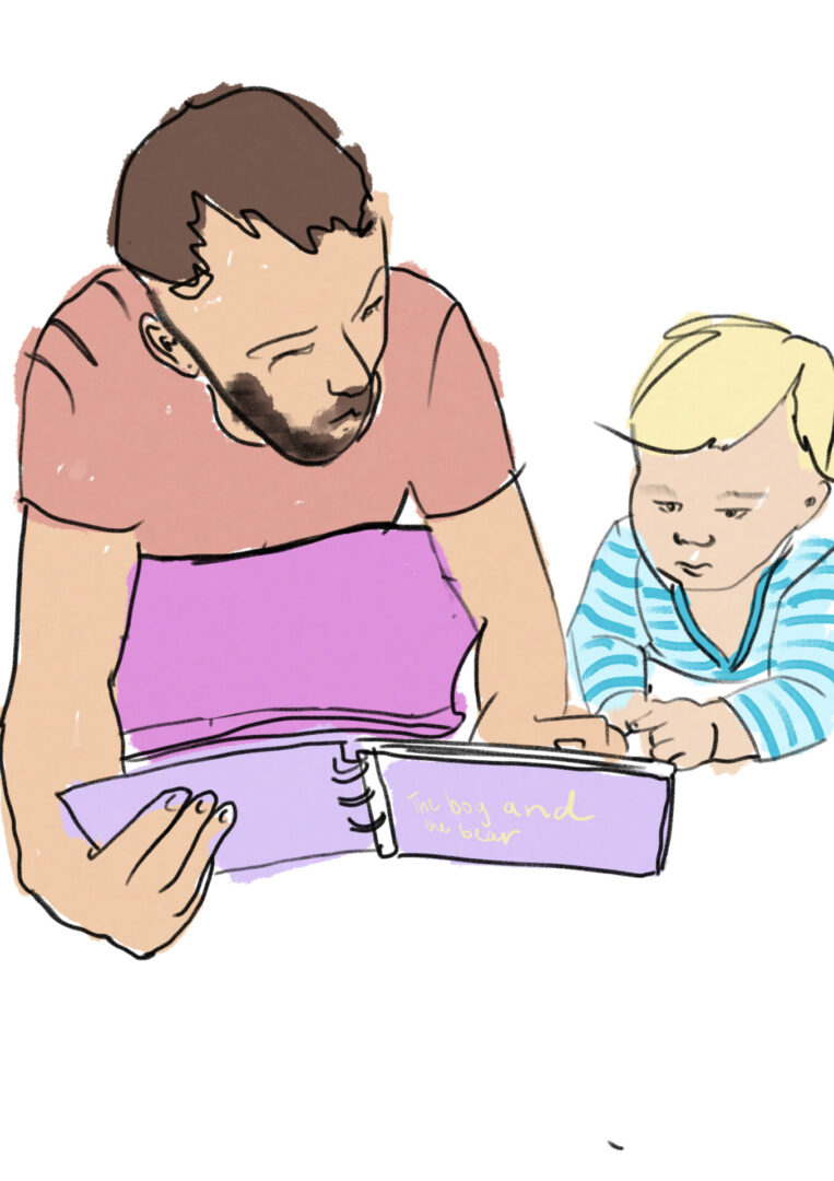 A man and child looking at an open book.