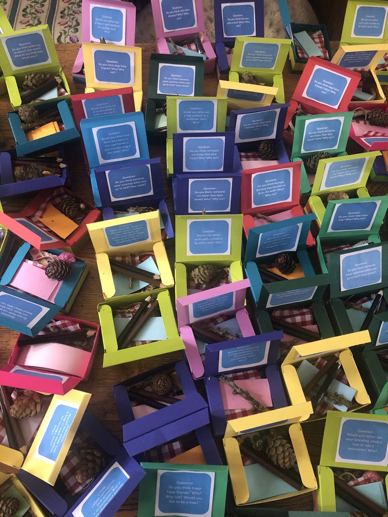 A pile of small colored boxes sitting on top of each other.