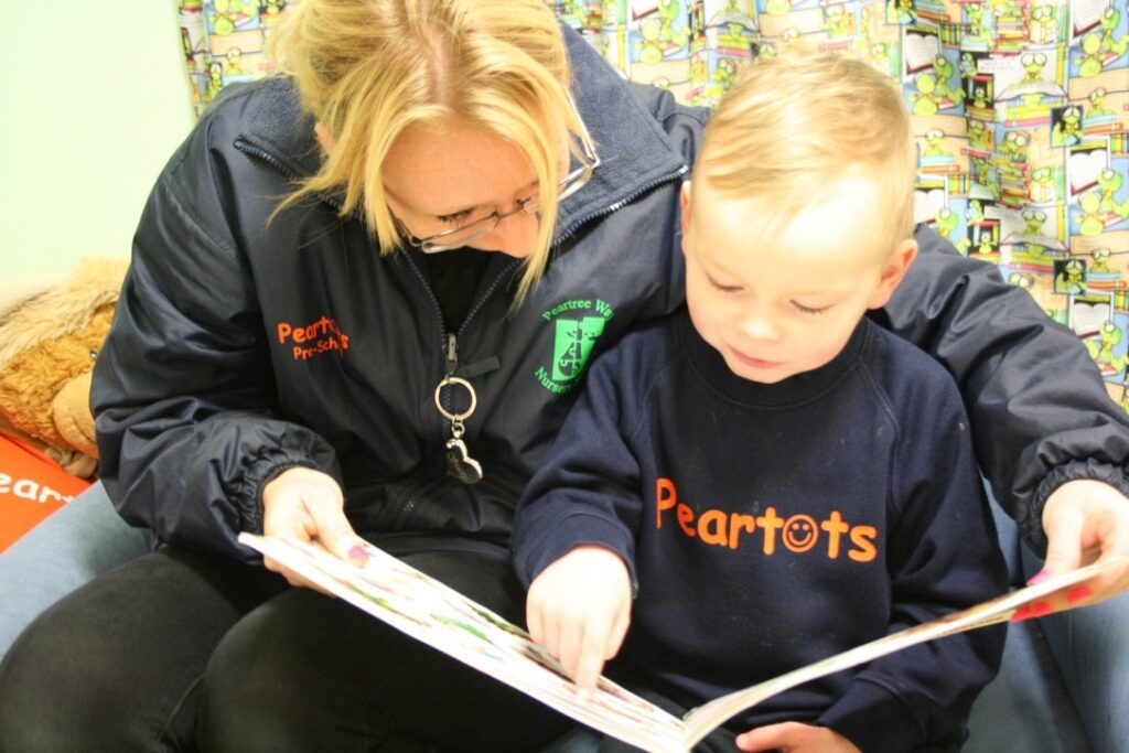 A woman and child reading a book